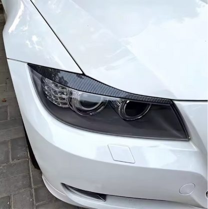 E90 Headlight Eyebrows Trim – Gloss Black / Carbon Look (E9X 2005–2012, Pre-LCI & LCI)